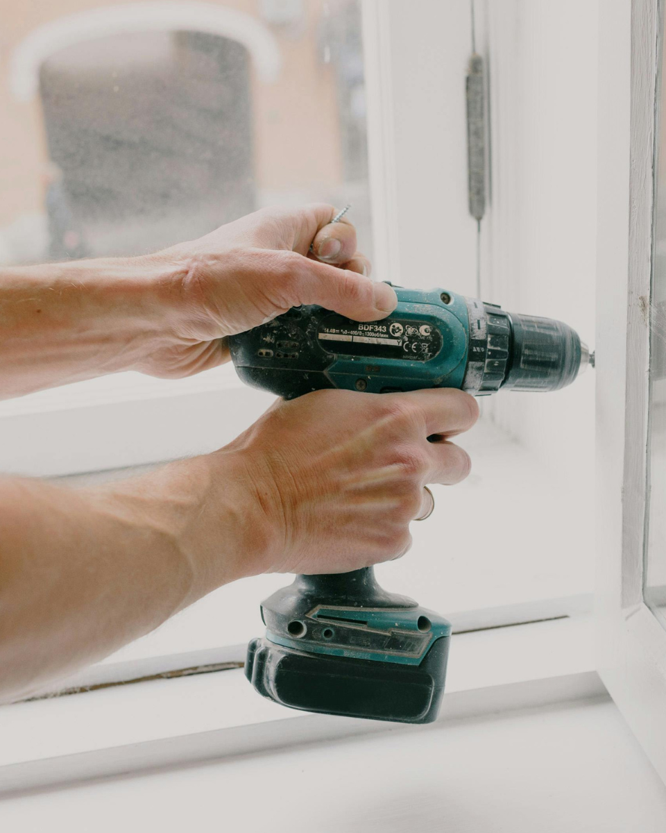  a factotum / handyman carries out a repair at his client's home